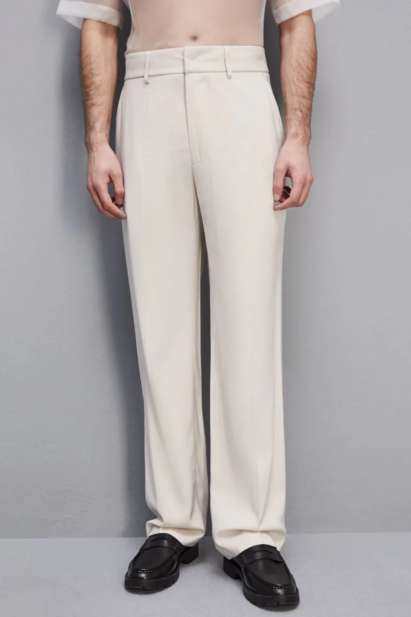 Spodnie slim fit ze wpuszczanymi kieszeniami